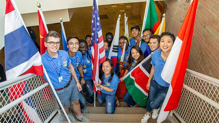Photo of international students with flags from their countries