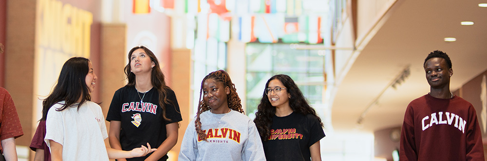 Calvin students walking in the Spoelhof Fieldhouse Complex