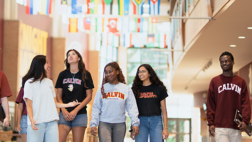 Calvin University students walking in the Spoelhof Fieldhouse Complex